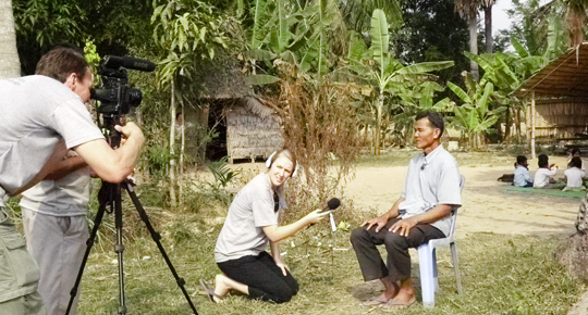 ChangeStream Media staff interview a village chief in a rural part of Cambodia for a video about a preschool program.